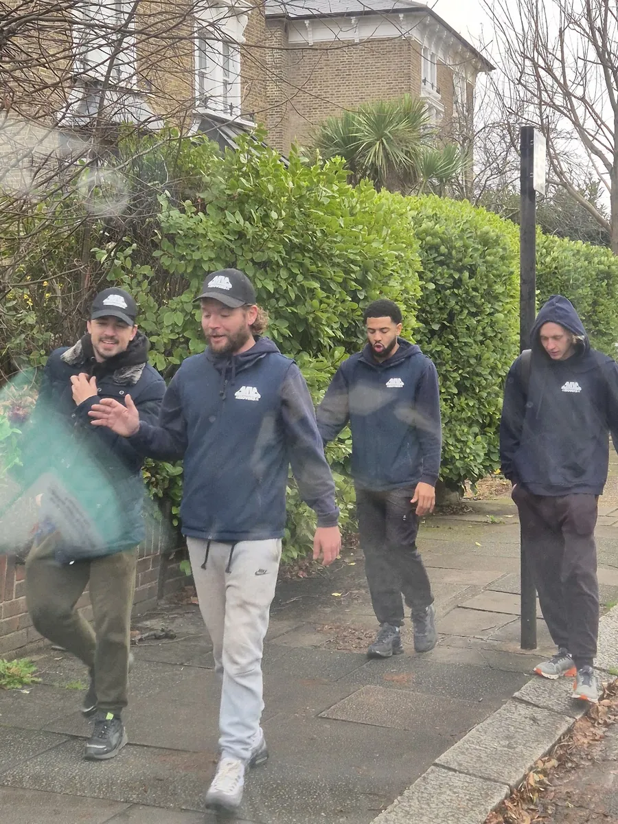 Walking in with the kit – Four up – MV Movers crew